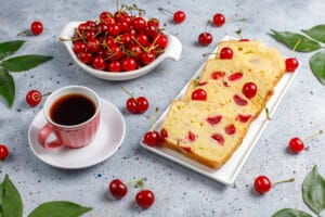 A perfectly baked cherry cheesecake with a golden graham cracker crust, creamy filling, and vibrant cherry topping.